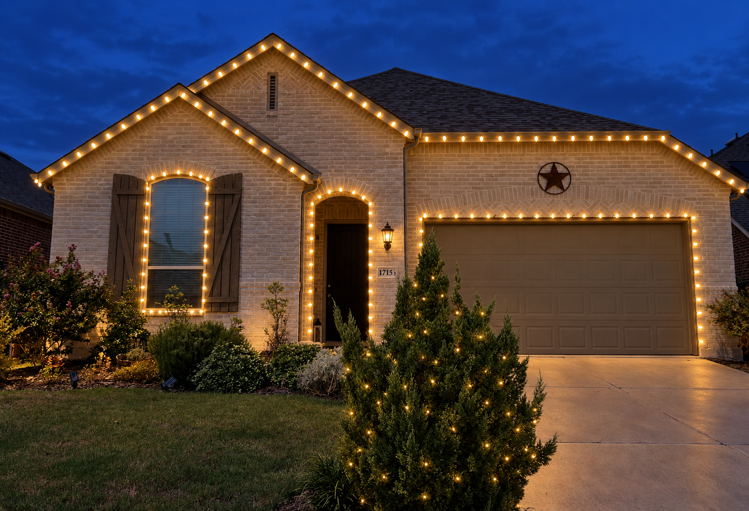 HOA community entrance holiday lights arch gate night